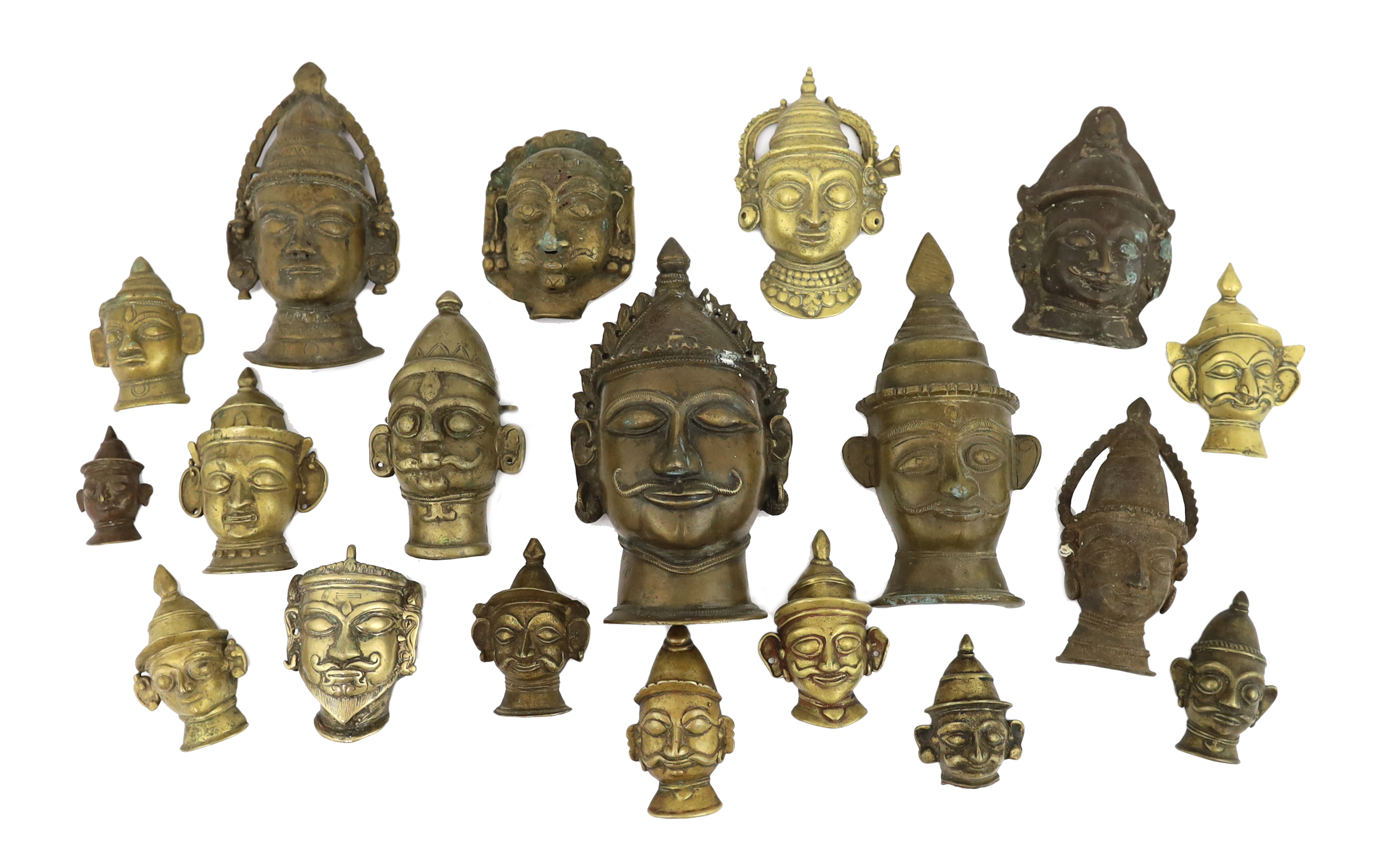 A group of nineteen bronze or brass Shiva masks, Southern India, 16th-19th century, 6.2 - 19.5cm high